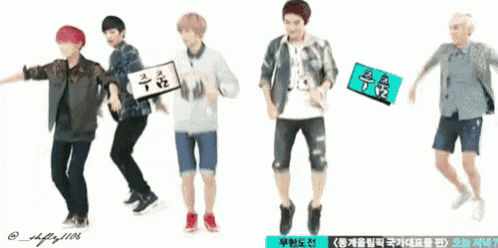 a group of young men are dancing and one of them has a sign that says ' a ' on it