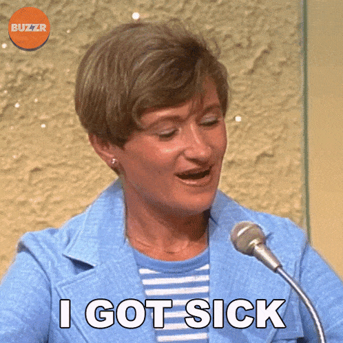 a woman speaking into a microphone with the words i got sick behind her