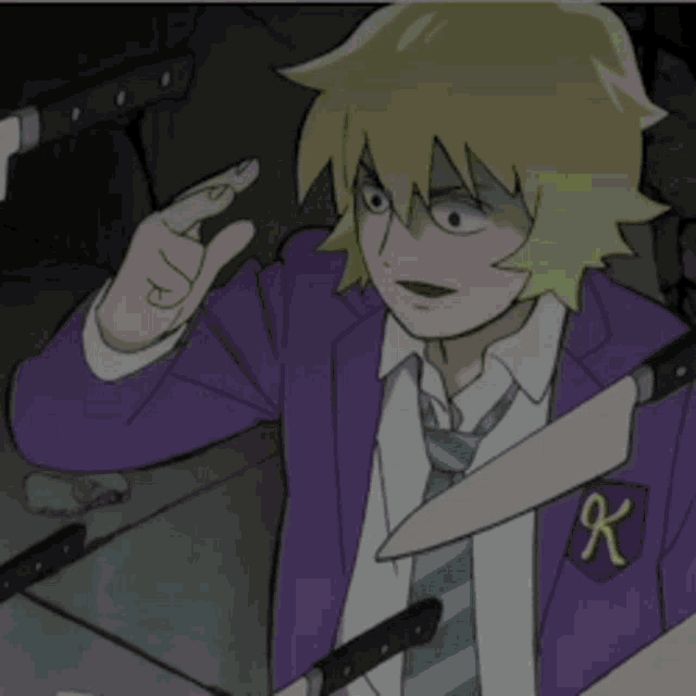 a man in a purple jacket and tie has a k on his pocket