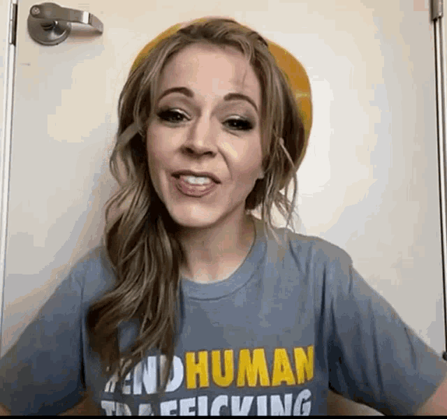 a woman wearing a shirt that says human trafficking