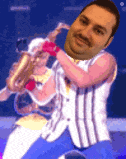 a man is playing a saxophone with a woman behind him