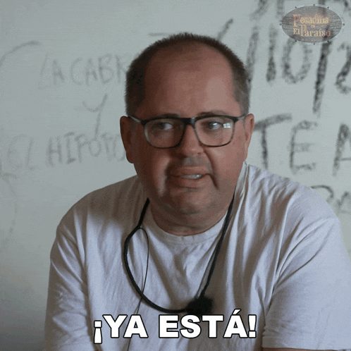 a man wearing glasses and a white shirt says ya está