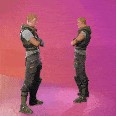 two soldiers are standing next to each other shaking hands