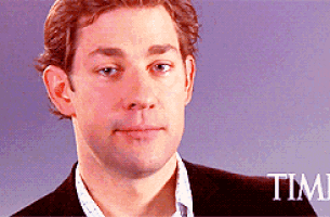 a close up of a man 's face with the word time in the background