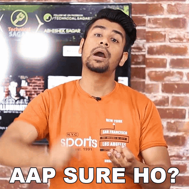 a man wearing an orange nyc sports t-shirt says aap sure ho