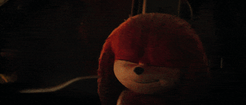 a man is driving a car at night and looking out the window