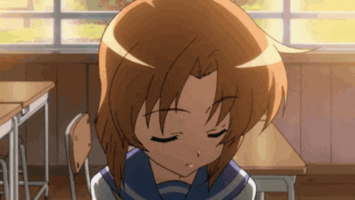 a girl with her eyes closed is sitting at a desk