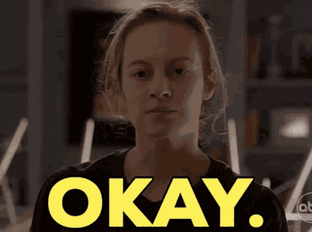 a woman in a black shirt says okay