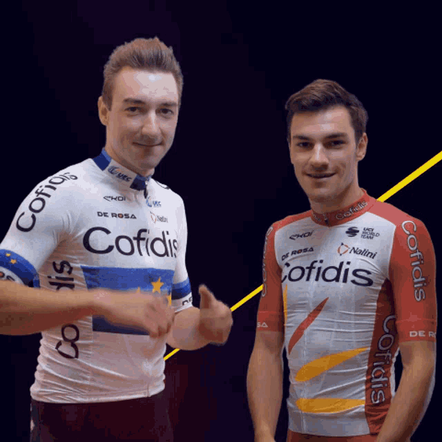 a man wearing a cofidis jersey stands next to another man