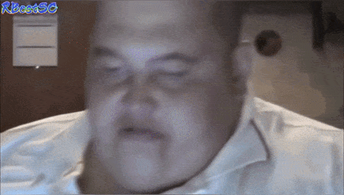 a close up of a man 's face with the words rbeat50 written on the bottom
