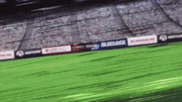 a blurry picture of a soccer field with a blue lock sign in the background .