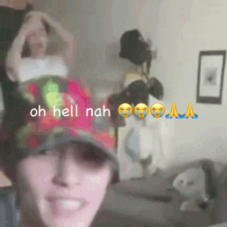 a woman wearing a hat says " oh hell nah " in a room
