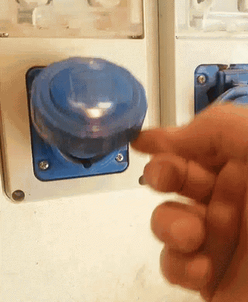 a person is pressing a button with their finger