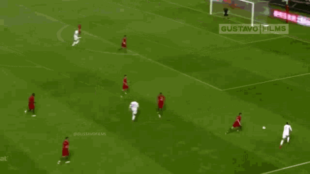 a soccer game is being played on a field with ads for gustavo films on the sidelines