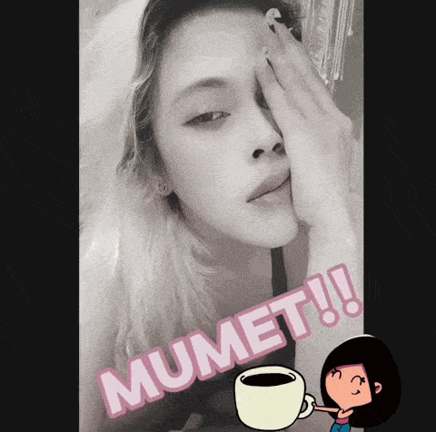 a black and white photo of a woman covering her face with her hand and the words mumet written on the bottom