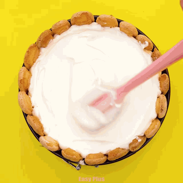 a cake with a spoon in it and easy plus written on the bottom