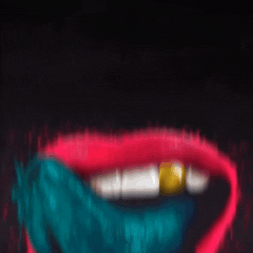a blurry picture of a woman 's mouth with a gold tooth