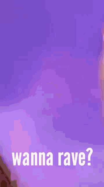 a close up of a woman with pink hair and the words `` wanna rave '' .