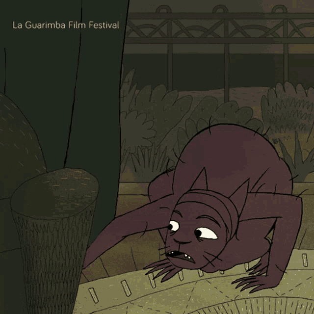 a cartoon drawing of a cat with la guarimba film festival written on the bottom right