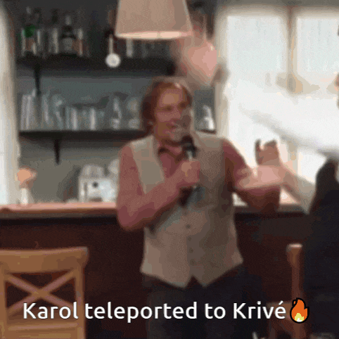 a man holding a microphone in front of a sign that says ' karol teleported to krivé '