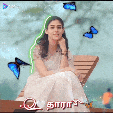 a woman in a white dress is surrounded by blue butterflies and the word gocut