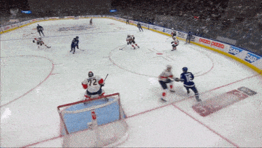 a hockey game is being played in a stadium sponsored by sap and pepsi
