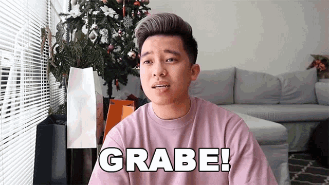 a man in a pink shirt says grabe