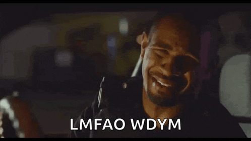 a police officer is crying in the back seat of a car while talking on a cell phone .
