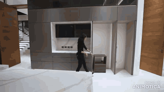 a woman is standing in a room with the words made in animatica on the bottom right