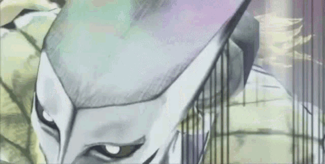 a close up of a person 's face with a white mask on their head .