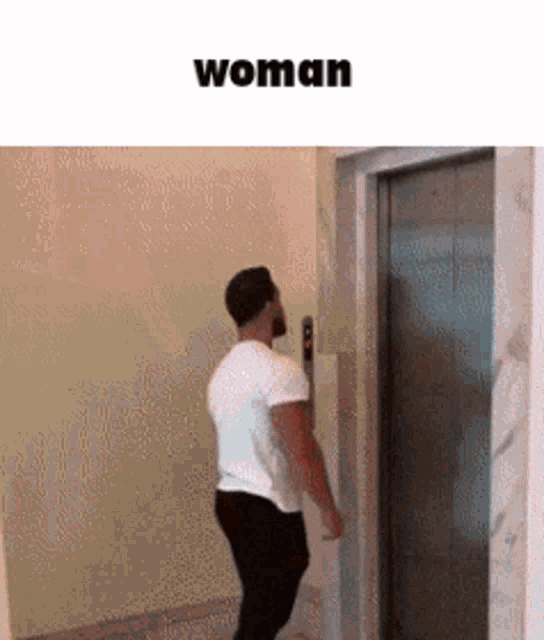 a man in a white shirt is standing in front of an elevator with the word woman above him .