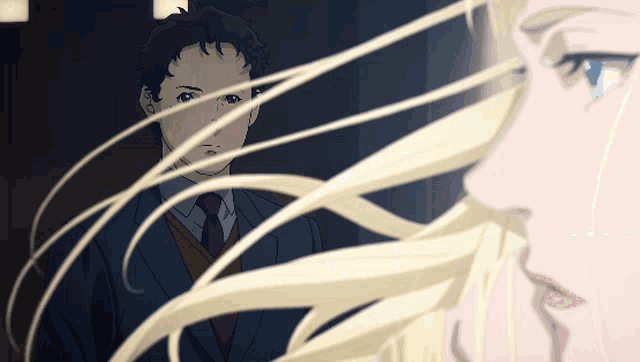 a man in a suit and tie is looking at a woman with long blonde hair