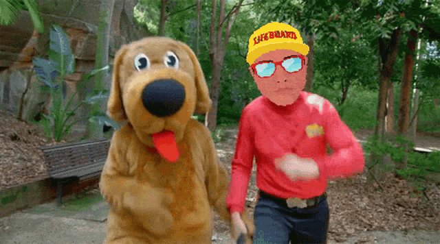 a man wearing a lifeguard hat and sunglasses stands next to a stuffed dog