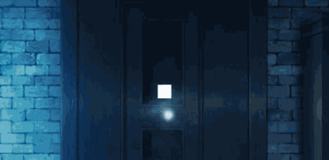 a blue brick wall with a white light shining through it
