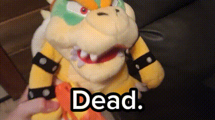a person is holding a stuffed animal with the word dead written on it .