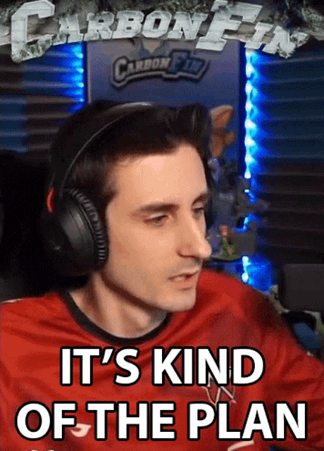 a man wearing headphones with the words it 's kind of the plan above him