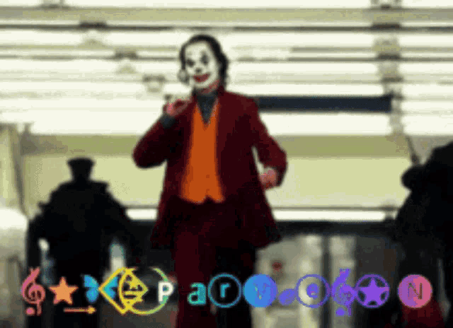 a clown in a red suit is standing in front of a sign that says n.