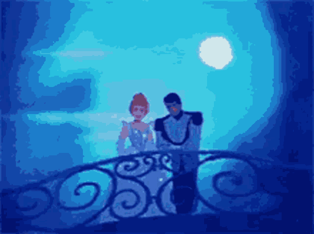 a man and a woman standing on a balcony looking at the moon