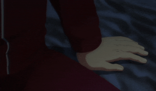 a close up of a person 's hand on a blue surface