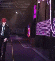 a man with red hair is wearing a suit and tie
