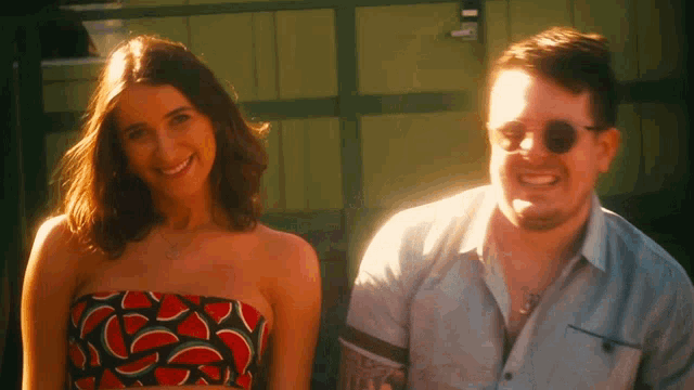 a man and a woman are posing for a picture together