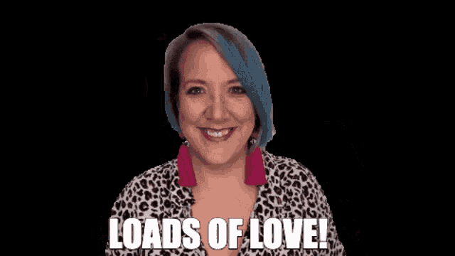 a woman in a leopard print shirt waves her hand and says " loads of love "