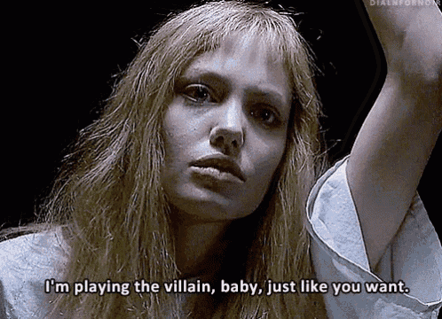a woman with long blonde hair says i 'm playing the villain baby just like you want .