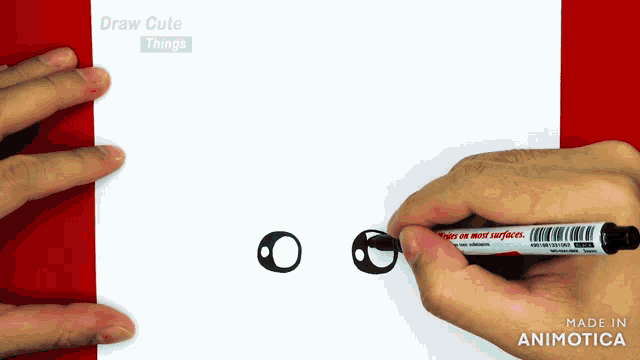 a person drawing with a marker that says " inspire on most surfaces " on it