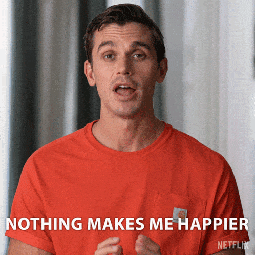 a man wearing an orange shirt says nothing makes me happier