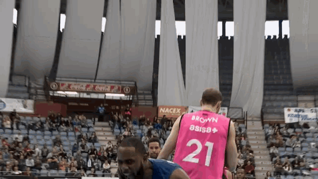 a basketball player with the number 21 on his back