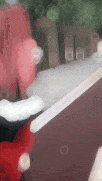 a blurred image of a red and white object with a white stripe on it