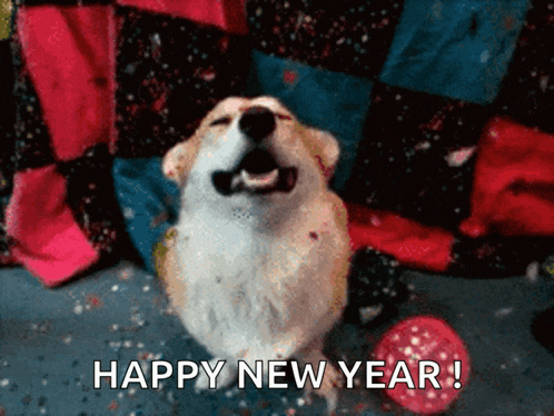 a dog sitting next to a red ball with the words happy new year written below it