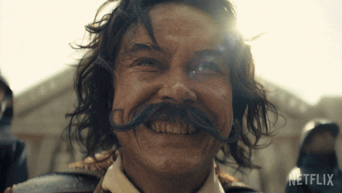 a man with a mustache is smiling in a netflix advertisement