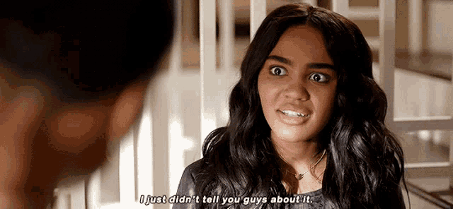 a young woman is talking to a man and says i just did n't tell you guys about it .